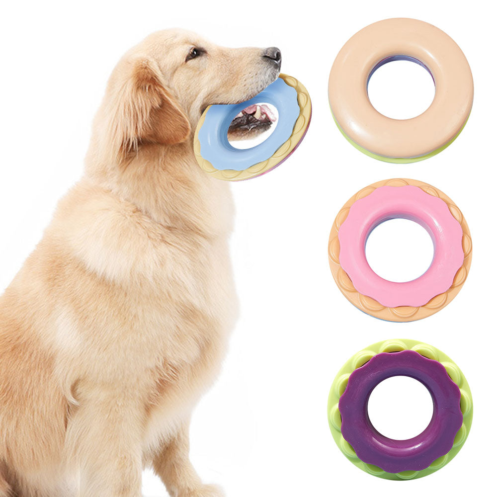 Dog biting the donut fetch toy